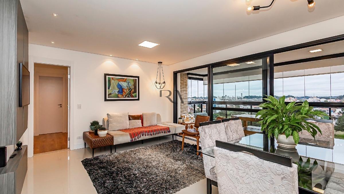 Sala de estar de apartamento de 112 m² à venda no Ecoville, em Curitiba
